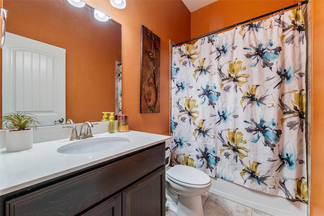 full bathroom featuring vanity, toilet, tile patterned flooring, and shower / bath combo