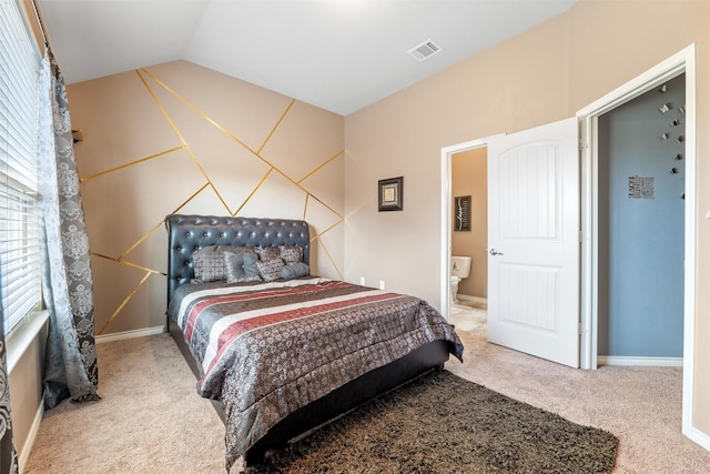 carpeted bedroom with lofted ceiling