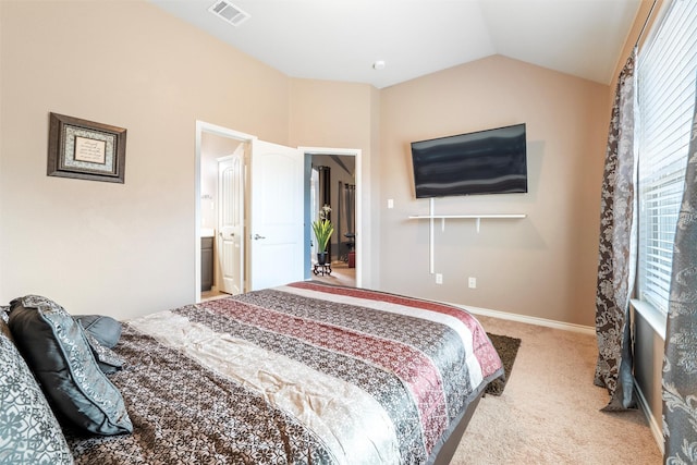 carpeted bedroom with vaulted ceiling