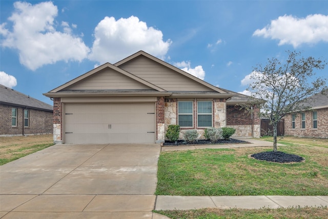 view of front of home featuring a garage and a front yard