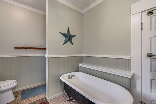 bathroom featuring crown molding, a bath, and toilet