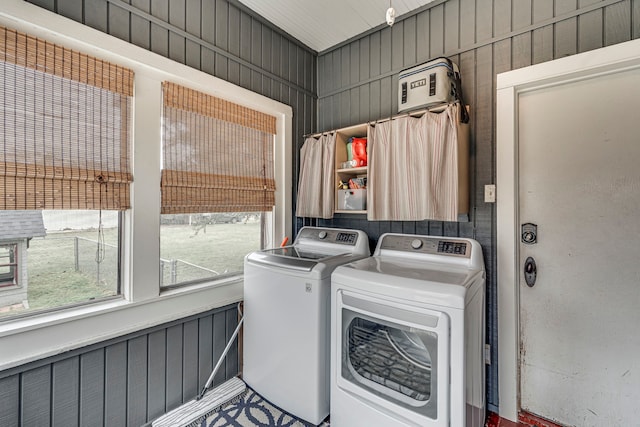 clothes washing area with independent washer and dryer