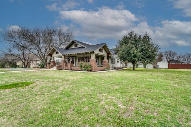 view of front of house with a porch and a front yard