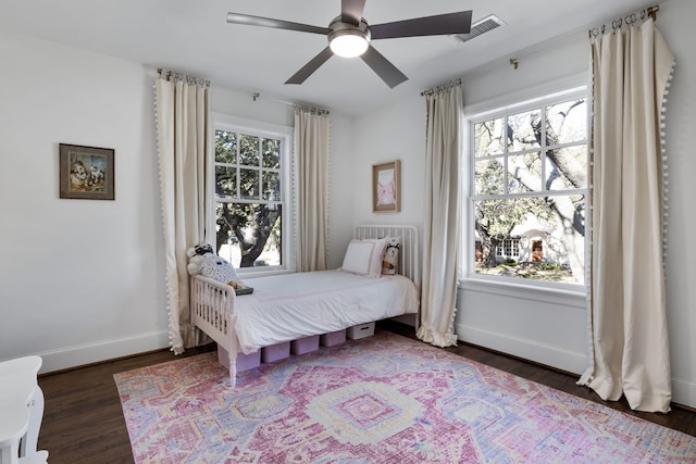 bedroom featuring dark hardwood / wood-style floors and ceiling fan