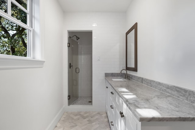 bathroom featuring vanity and walk in shower