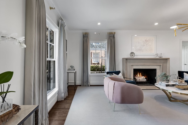 living room with ornamental molding and dark hardwood / wood-style floors