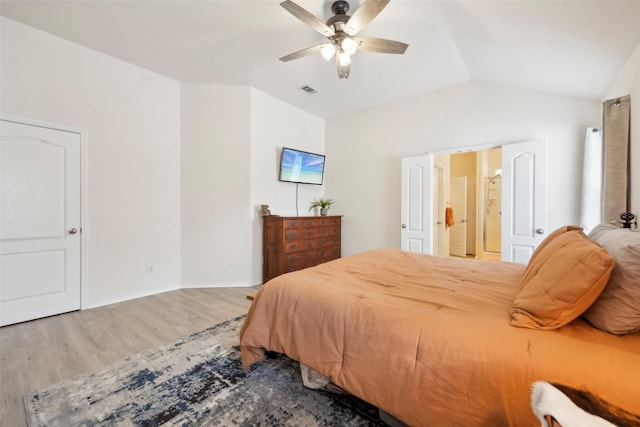 bedroom featuring hardwood / wood-style flooring, ceiling fan, and vaulted ceiling