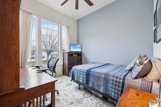 bedroom featuring lofted ceiling and ceiling fan