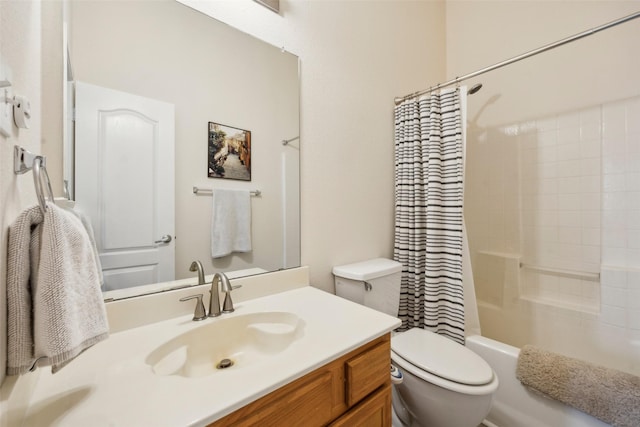 full bathroom with shower / bath combination with curtain, vanity, and toilet