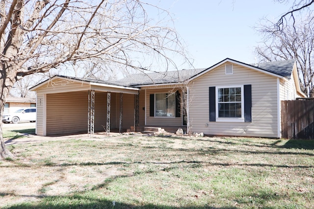 ranch-style home with a front lawn