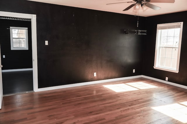 spare room featuring hardwood / wood-style flooring and ceiling fan