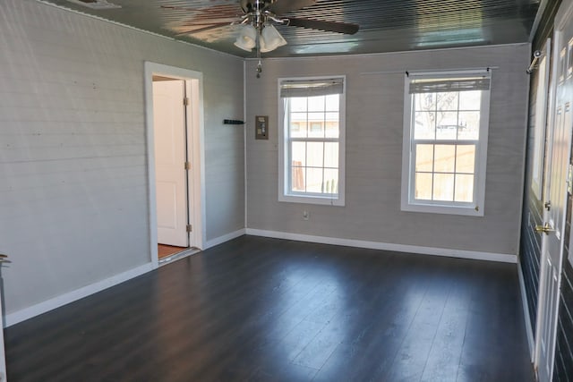 spare room with ceiling fan and dark hardwood / wood-style floors