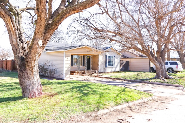 ranch-style home with a front yard