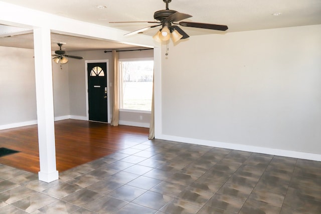 tiled foyer with ceiling fan