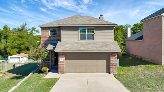 view of front of home featuring a garage and a front lawn