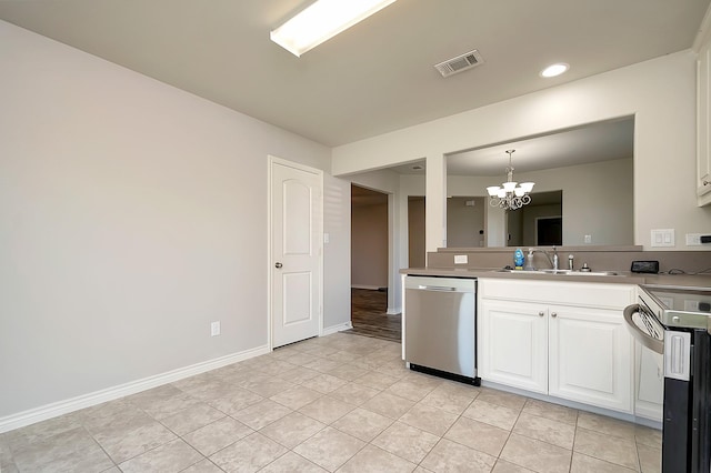 kitchen with sink, an inviting chandelier, hanging light fixtures, appliances with stainless steel finishes, and white cabinets