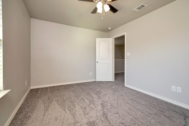 carpeted empty room featuring ceiling fan