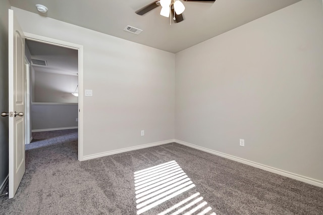 carpeted empty room with ceiling fan