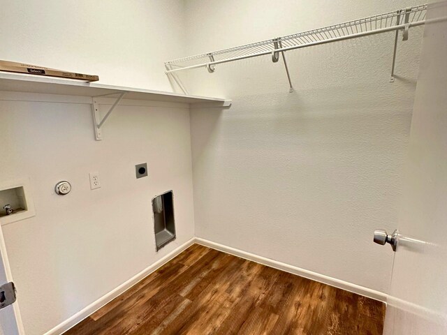 laundry area featuring dark hardwood / wood-style floors, hookup for an electric dryer, hookup for a gas dryer, and hookup for a washing machine