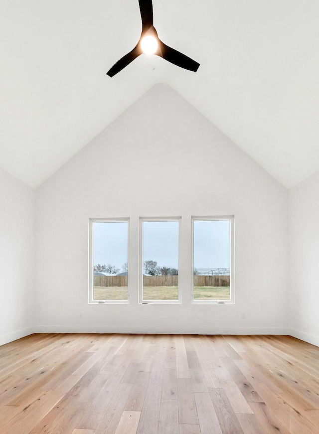 additional living space with high vaulted ceiling, light hardwood / wood-style floors, and a wealth of natural light