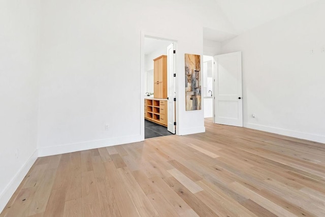 unfurnished room with light wood-type flooring