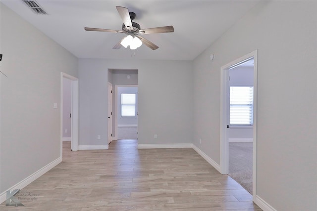 empty room featuring light hardwood / wood-style floors and ceiling fan