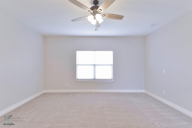 unfurnished room featuring light colored carpet and ceiling fan