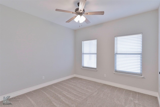 spare room featuring ceiling fan and light carpet