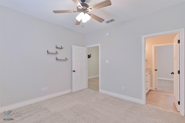 unfurnished bedroom with light carpet and ceiling fan