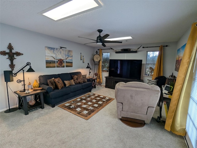 carpeted living room featuring ceiling fan