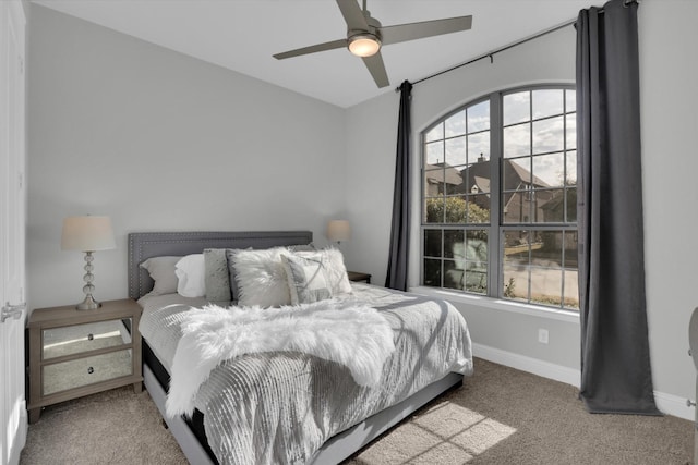 bedroom with multiple windows, carpet floors, and ceiling fan