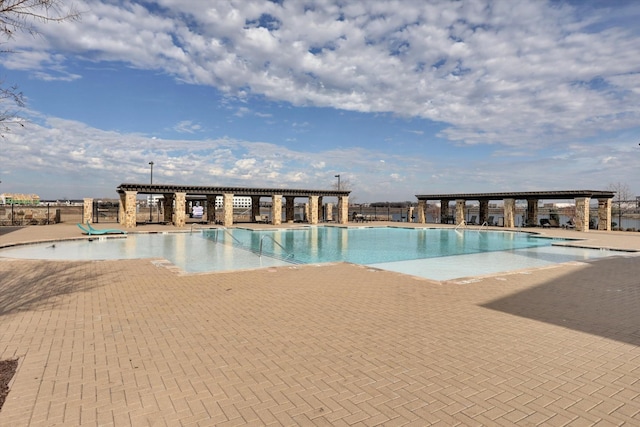 view of swimming pool with a patio