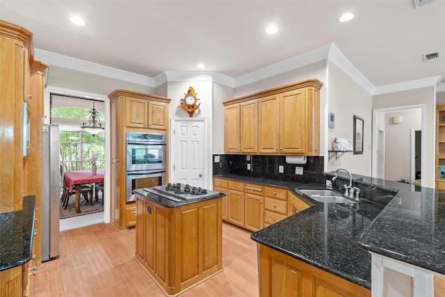 kitchen featuring light hardwood / wood-style floors, sink, stainless steel appliances, and kitchen peninsula