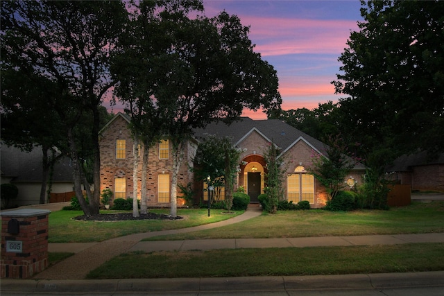 view of front of home with a yard