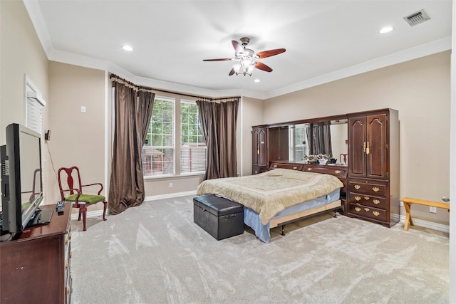 bedroom featuring crown molding, light colored carpet, and ceiling fan