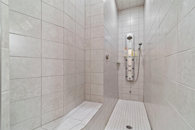 bathroom with tiled shower