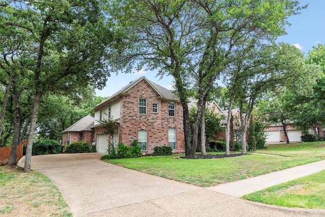 view of front facade with a garage and a front lawn