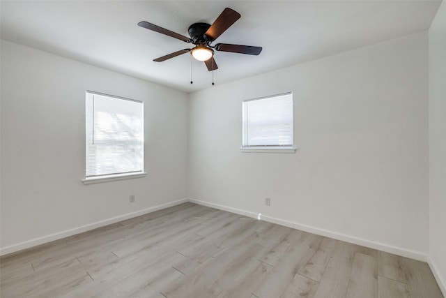 spare room with ceiling fan and light hardwood / wood-style flooring