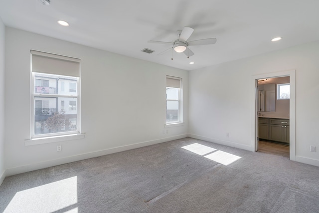 2125 Bird St, Fort Worth, TX 76111 - unfurnished bedroom with light carpet, recessed lighting, ensuite bath, and ceiling fan