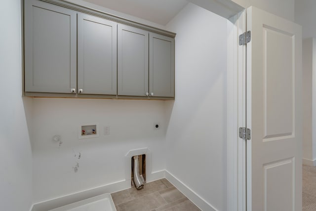 2125 Bird St, Fort Worth, TX 76111 - washroom with hookup for a gas dryer, hookup for an electric dryer, washer hookup, and cabinet space