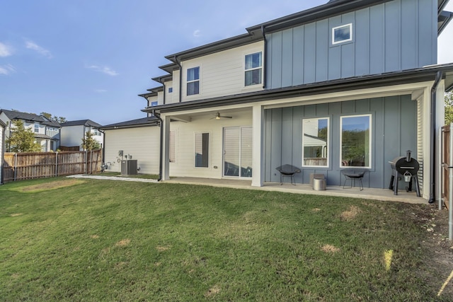 2125 Bird St, Fort Worth, TX 76111 - back of house with board and batten siding, a patio area, and ceiling fan