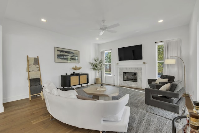 2125 Bird St, Fort Worth, TX 76111 - living room with ceiling fan, wood finished floors, a fireplace, and recessed lighting