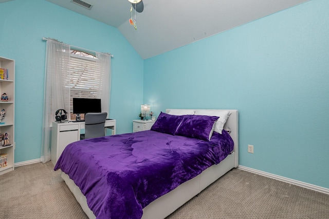 carpeted bedroom featuring ceiling fan and vaulted ceiling