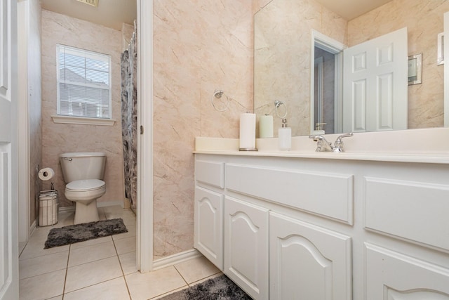 bathroom with vanity, tile patterned floors, toilet, and a shower with shower curtain