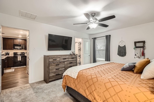 bedroom with light colored carpet and ceiling fan