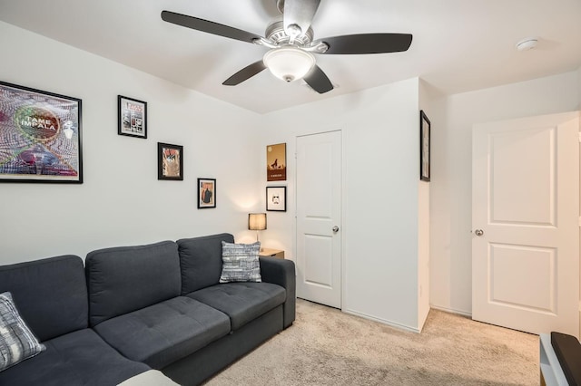 living room featuring ceiling fan and light carpet