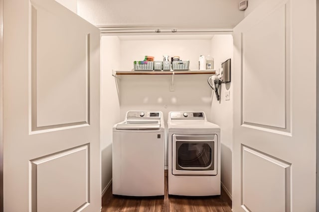 laundry area with dark wood-type flooring and washing machine and dryer