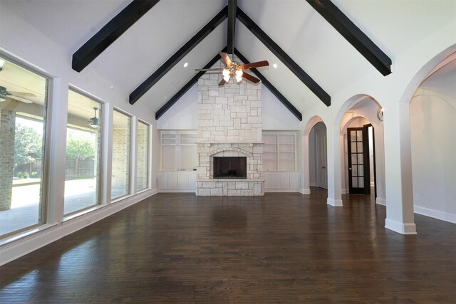 3019 Haywick, The Colony, TX 75056 - unfurnished living room featuring a ceiling fan, beamed ceiling, dark wood-style flooring, baseboards, and high vaulted ceiling