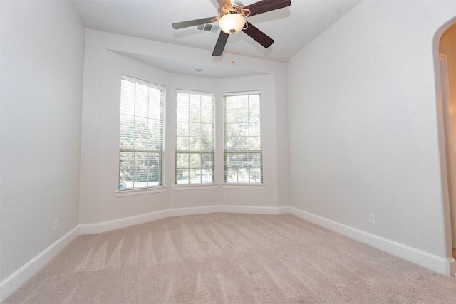 3019 Haywick, The Colony, TX 75056 - carpeted spare room with arched walkways, plenty of natural light, baseboards, and ceiling fan
