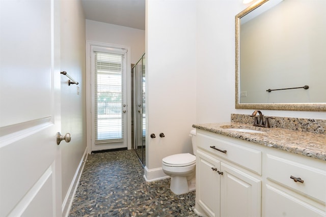 3019 Haywick, The Colony, TX 75056 - bathroom with toilet, a shower stall, vanity, and baseboards